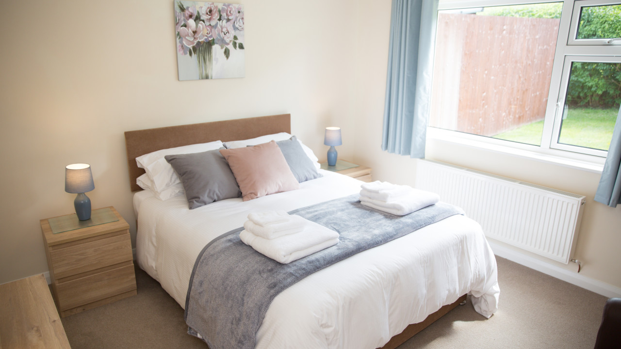One of the two comfortable bedrooms with King-size beds at Wall & Lakes holiday cottage