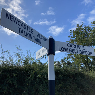 Signpost to Gelt Woods, Talkin Tarn, Carlisle, Alston & Newcastle near Wall & Lakes Cottage Brampton