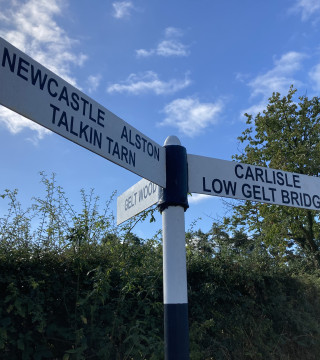 Signpost to Gelt Woods, Talkin Tarn, Carlisle, Alston & Newcastle near Wall & Lakes Cottage Brampton