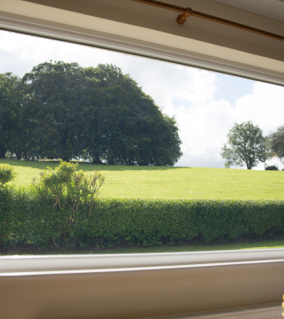 Peaceful, countryside view from the living room at Wall and Lakes holiday cottage, Brampton