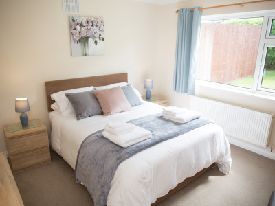 One of the two comfortable bedrooms with King-size beds at Wall & Lakes holiday cottage