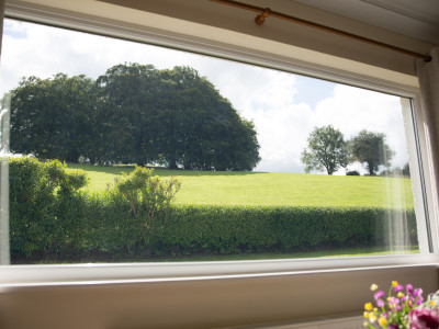 Peaceful, countryside view from the living room at Wall and Lakes holiday cottage, Brampton